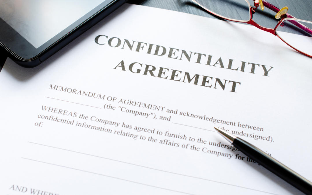 Business professionals discussing over a confidentiality agreement document